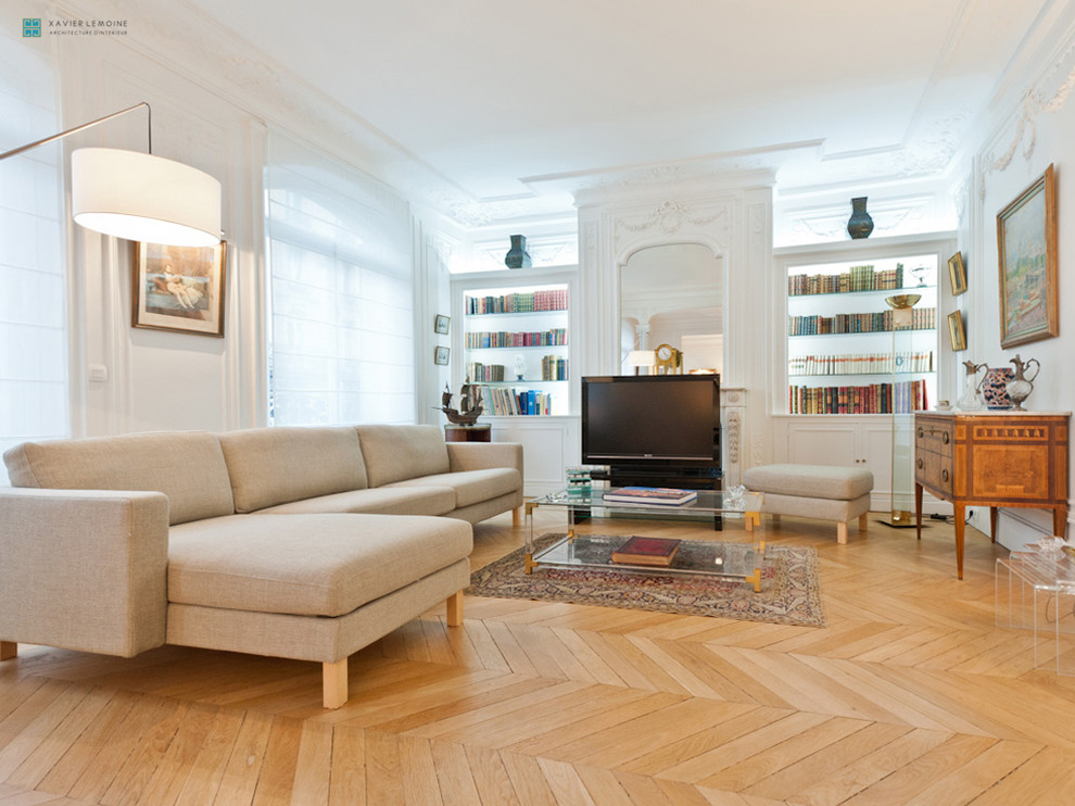 Living room library - large transitional open concept light wood floor living room library idea in Paris with white walls, a standard fireplace, a stone fireplace and a tv stand