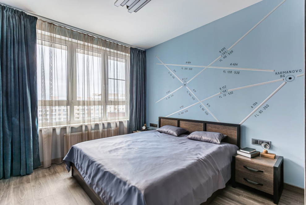 This is an example of a contemporary bedroom in Moscow with blue walls, dark hardwood floors and brown floor.