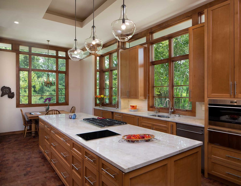Inspiration for a large arts and crafts l-shaped separate kitchen in Atlanta with an undermount sink, shaker cabinets, dark wood cabinets, marble benchtops, window splashback, stainless steel appliances, dark hardwood floors, with island and brown floor.