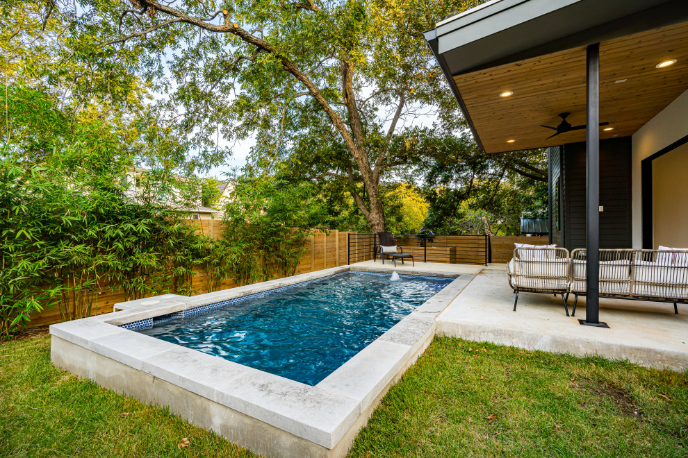 Design ideas for a contemporary swimming pool in Austin.
