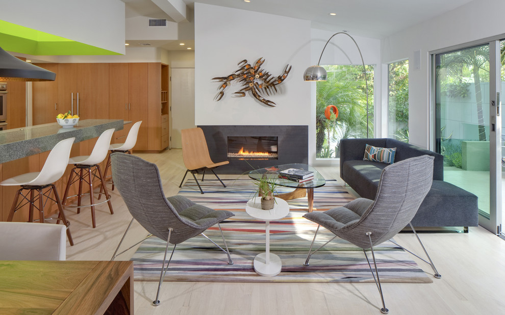Inspiration for a midcentury formal open concept living room in Los Angeles with white walls, light hardwood floors, a ribbon fireplace and no tv.
