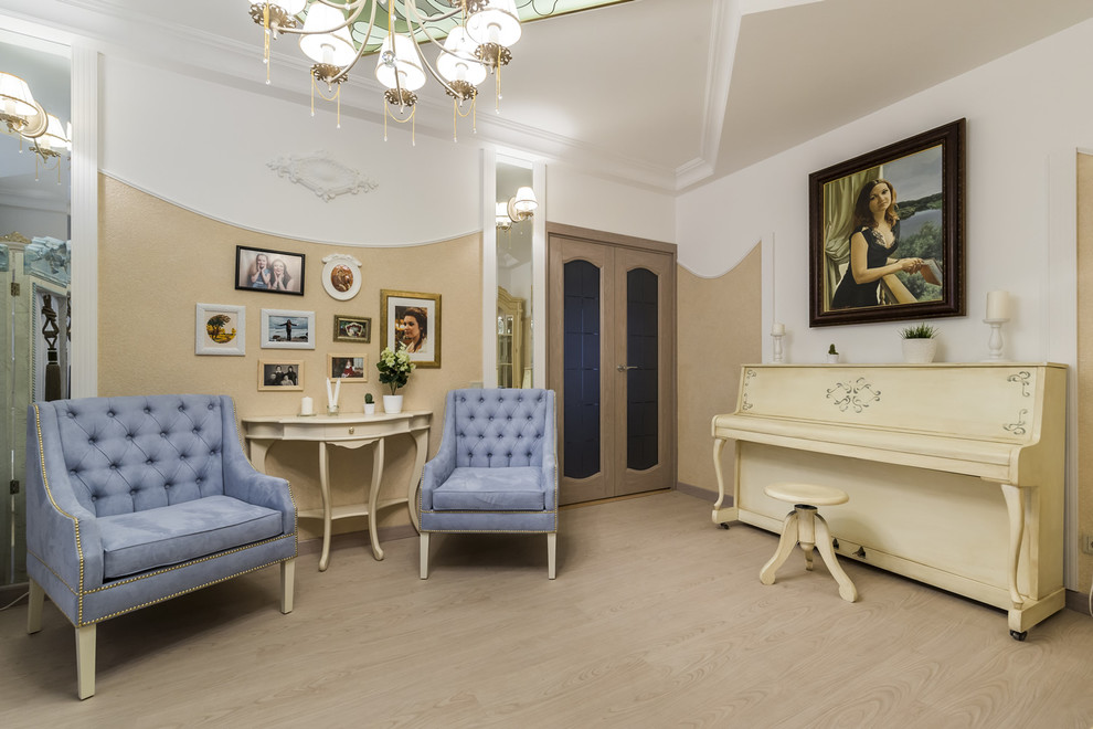 This is an example of a small traditional enclosed living room in Moscow with a music area, beige walls and light hardwood floors.