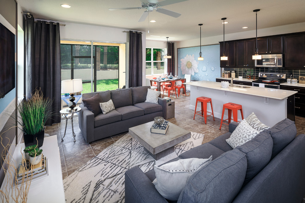 This is an example of a contemporary open concept family room in Orlando with a wall-mounted tv.