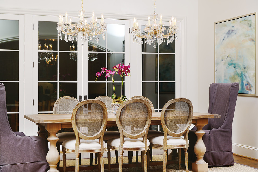 Inspiration for a large traditional separate dining room in Raleigh with white walls and medium hardwood floors.