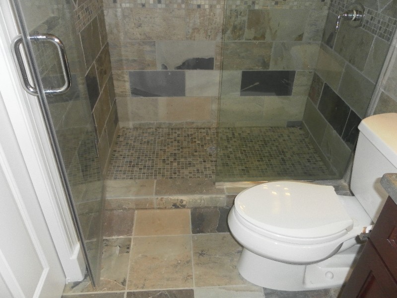 Alcove shower - transitional multicolored tile alcove shower idea in Chicago with dark wood cabinets
