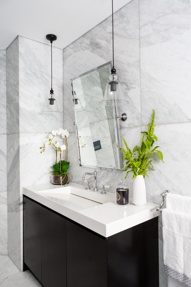 Mid-sized contemporary master bathroom in Sydney with flat-panel cabinets, dark wood cabinets, marble, marble floors, an integrated sink and marble benchtops.