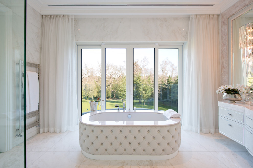 Inspiration for a traditional master bathroom in Surrey with beige cabinets, an undermount tub and flat-panel cabinets.
