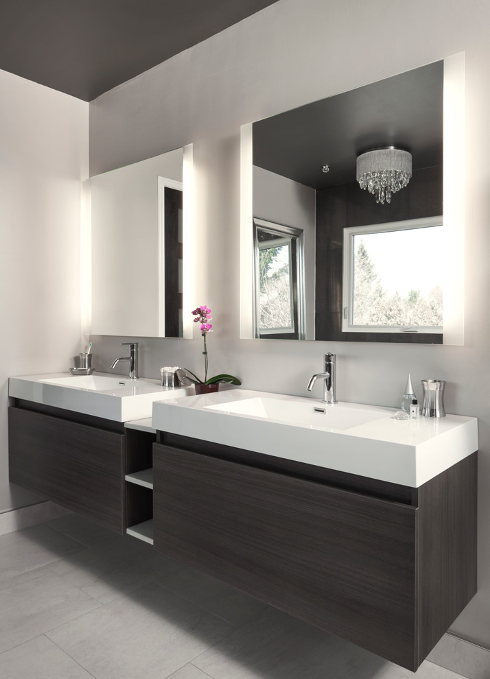 Contemporary bathroom in Toronto with an integrated sink, flat-panel cabinets, grey cabinets, quartzite benchtops, a freestanding tub, a corner shower, beige tile, porcelain tile, grey walls and limestone floors.