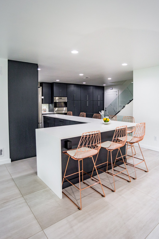Photo of a large modern l-shaped eat-in kitchen in Other with a drop-in sink, flat-panel cabinets, grey cabinets, multi-coloured splashback, marble splashback, stainless steel appliances, ceramic floors, with island, white floor and white benchtop.