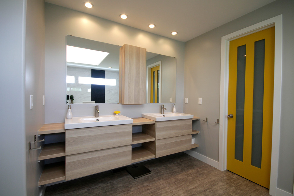 Large contemporary master bathroom in Denver with open cabinets, light wood cabinets, grey walls, wood benchtops, a drop-in tub, linoleum floors, an open shower, white tile, black tile, stone slab and an integrated sink.
