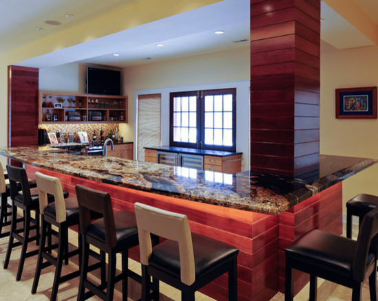 Design ideas for a mid-sized traditional l-shaped wet bar in St Louis with raised-panel cabinets, dark wood cabinets, granite benchtops, ceramic floors and grey floor.
