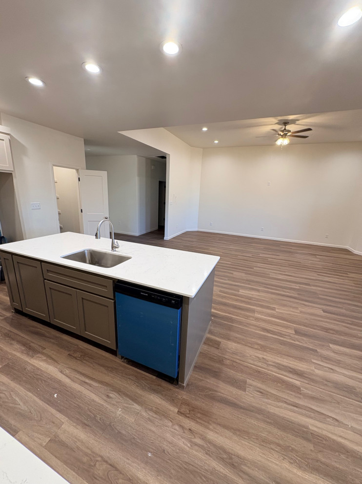 Under Construction- Broad view of the kitchen Island looking to the entry way