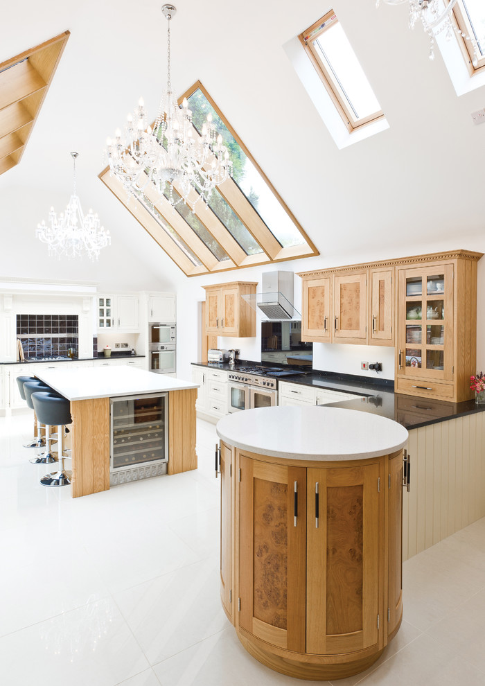 Design ideas for a transitional u-shaped kitchen in Other with shaker cabinets, medium wood cabinets, white splashback, stainless steel appliances, with island, white floor and white benchtop.