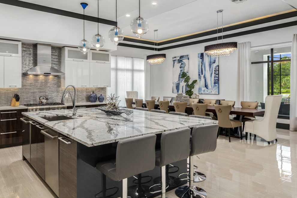 Inspiration for a large modern u-shaped open plan kitchen in Orlando with a drop-in sink, flat-panel cabinets, dark wood cabinets, quartz benchtops, metallic splashback, glass tile splashback, stainless steel appliances, porcelain floors and with island.