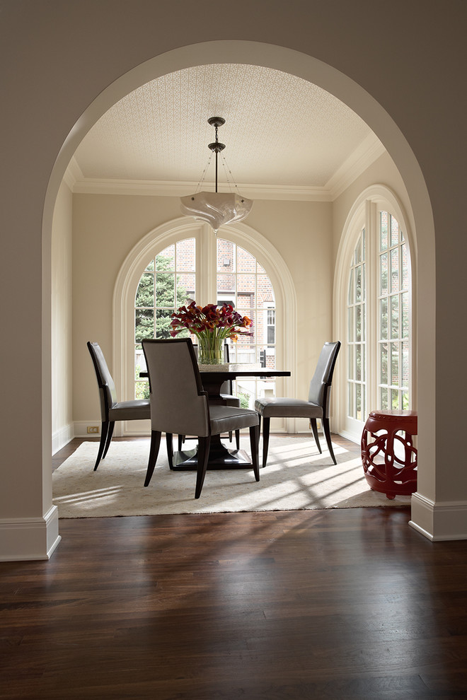 Traditional dining room in Minneapolis with dark hardwood floors and beige walls.