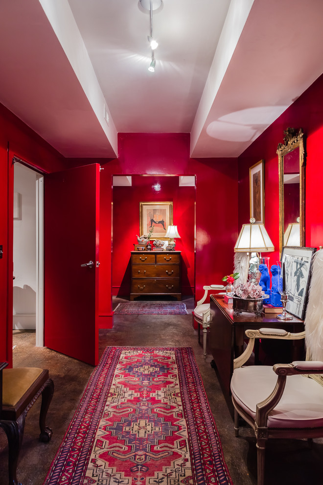 Inspiration for an eclectic hallway in Raleigh with red walls and concrete floors.