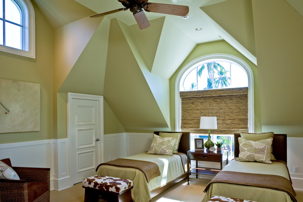 Photo of a tropical guest bedroom in Orlando with green walls, carpet and no fireplace.