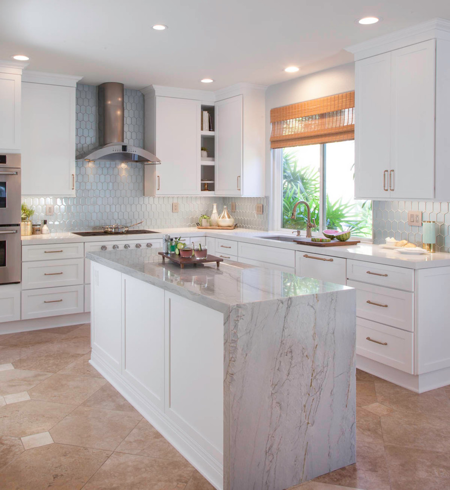 Inspiration for a mid-sized u-shaped open plan kitchen in Denver with an undermount sink, shaker cabinets, white cabinets, quartzite benchtops, blue splashback, glass tile splashback, stainless steel appliances, travertine floors, with island, beige floor and blue benchtop.