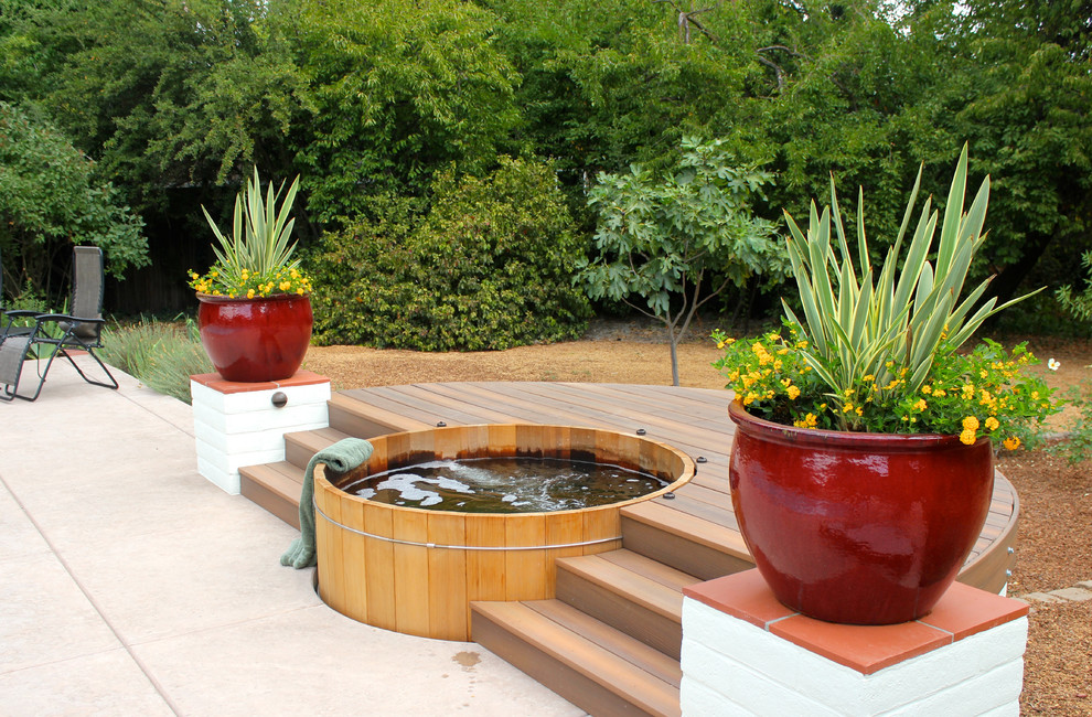 Design ideas for a mediterranean pool in Sacramento with a hot tub.