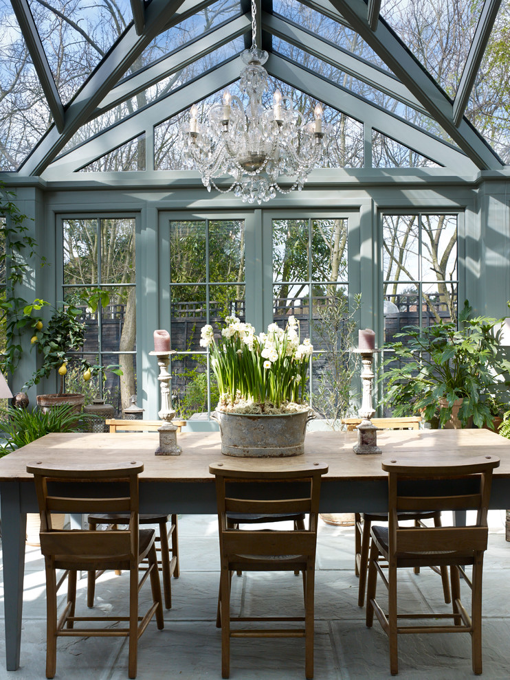 Design ideas for a traditional sunroom in London with a glass ceiling.