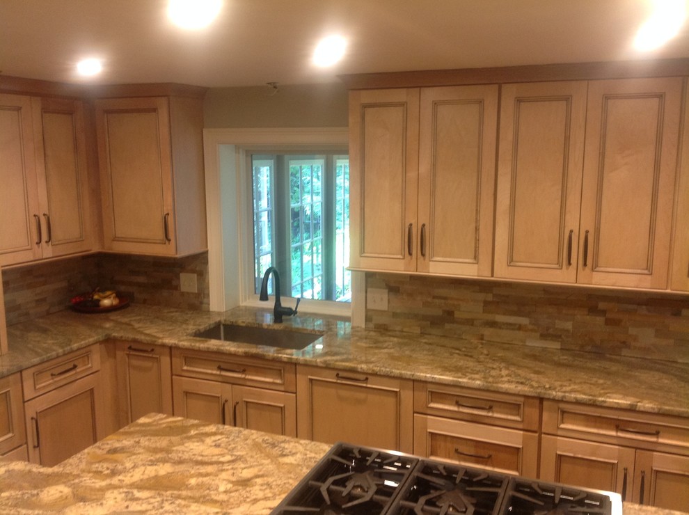Example of a mountain style home design design with granite countertops