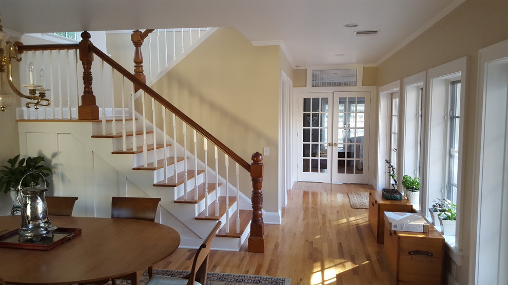 Photo of a mid-sized traditional wood l-shaped staircase in Orlando with wood risers.