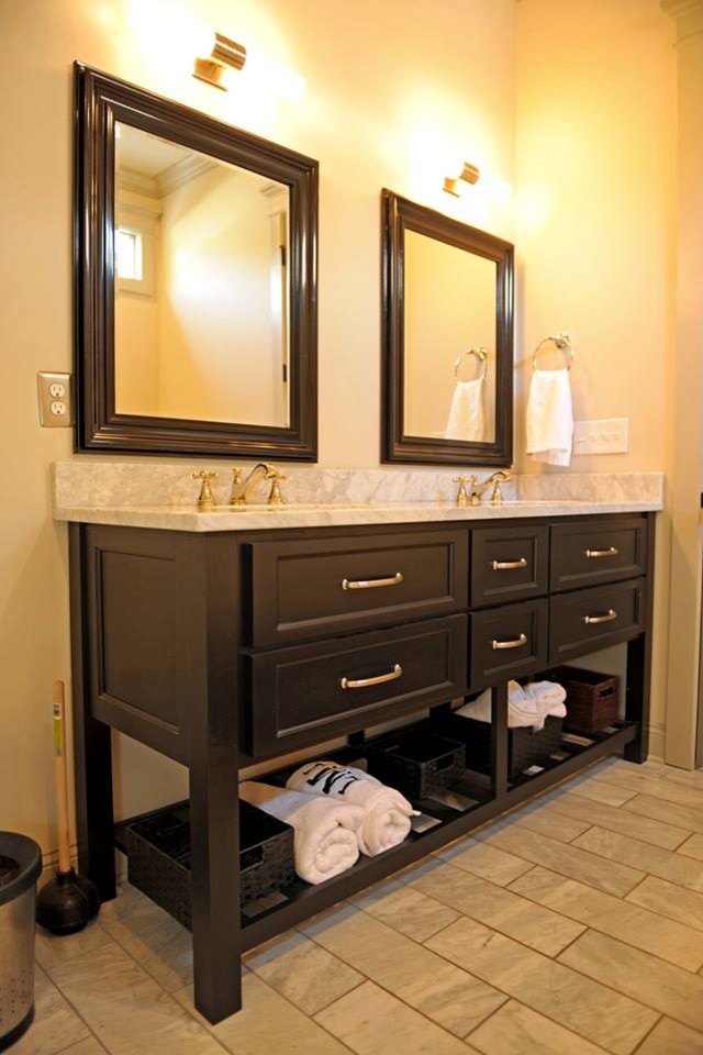 Design ideas for a large traditional master bathroom in Atlanta with furniture-like cabinets, black cabinets, beige walls, porcelain floors, an undermount sink and marble benchtops.