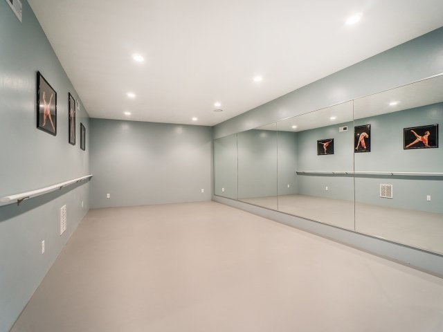 Photo of a large transitional home gym in Salt Lake City with grey walls.