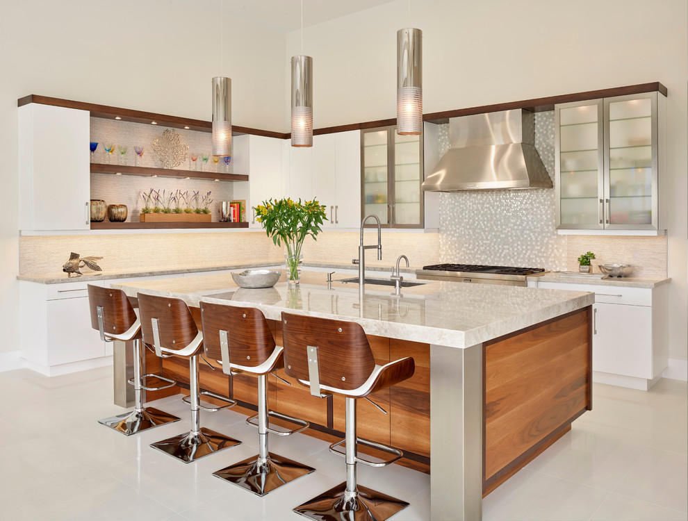 Inspiration for a contemporary l-shaped kitchen in Miami with an undermount sink, flat-panel cabinets, white cabinets, multi-coloured splashback, mosaic tile splashback, stainless steel appliances, with island, beige floor and beige benchtop.