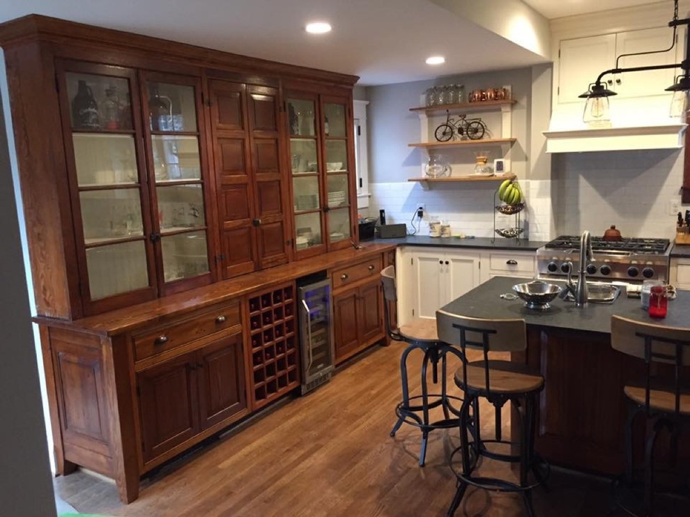 Mountain style medium tone wood floor and brown floor kitchen photo in Baltimore