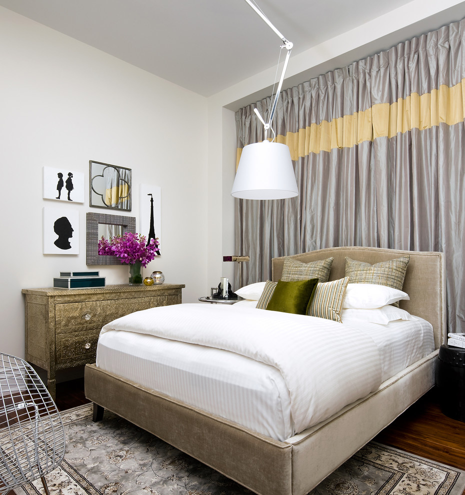 Eclectic bedroom in Toronto with white walls and dark hardwood floors.