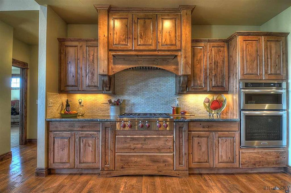Cabinet Install, Wood Floor Install, and Trim Work by Black Diamond