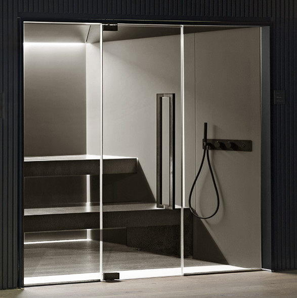 Photo of a contemporary wet room bathroom in Other with gray tile, stone slab, grey walls, with a sauna, grey floor, a hinged shower door and a shower seat.