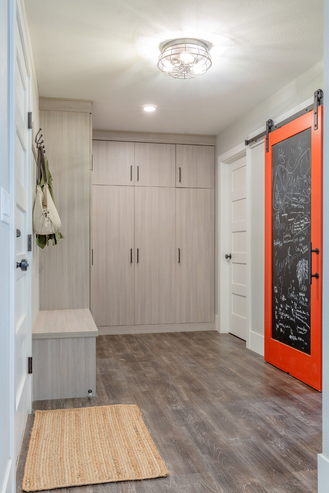 This is an example of a contemporary mudroom in Denver with grey walls, laminate floors, grey floor, a single front door and a white front door.