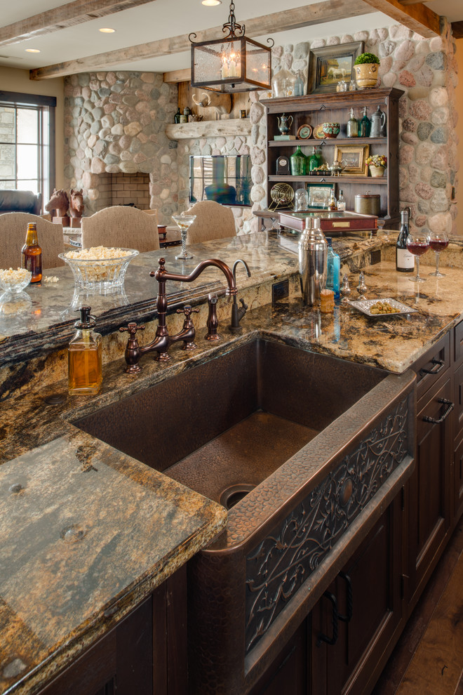 Inspiration for a seated home bar in Other with dark wood cabinets, granite benchtops and dark hardwood floors.