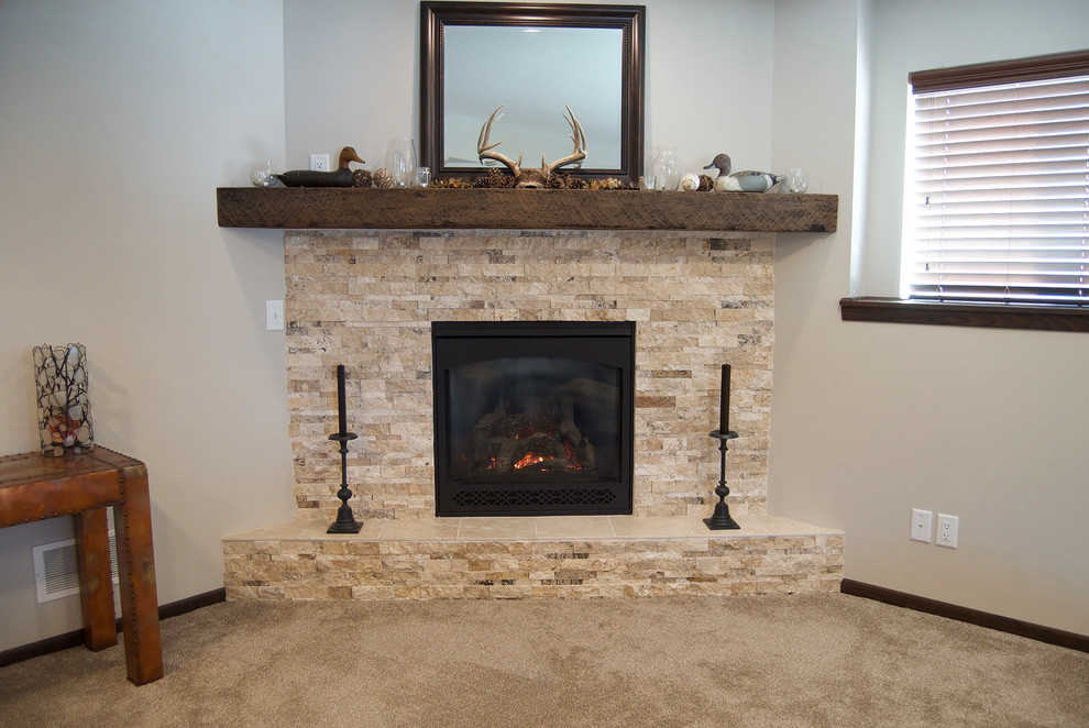 Mountain style carpeted and beige floor basement photo with a corner fireplace