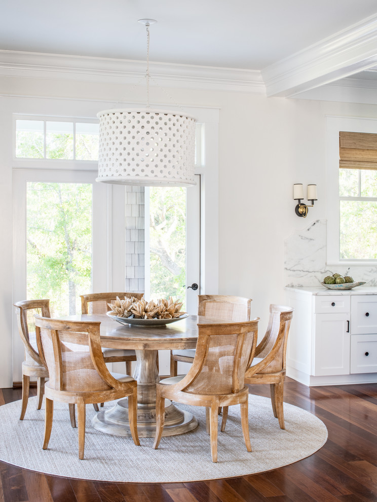 Kitchen/dining room combo - small coastal medium tone wood floor kitchen/dining room combo idea in Other with white walls and no fireplace