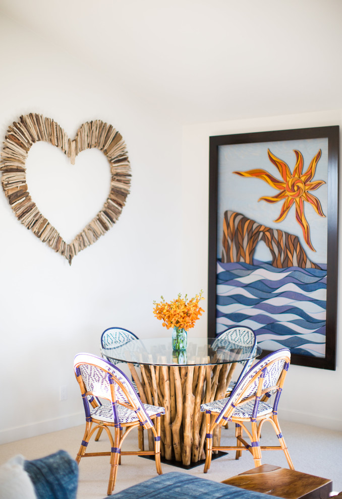 Photo of a beach style dining room in Santa Barbara with white walls and carpet.