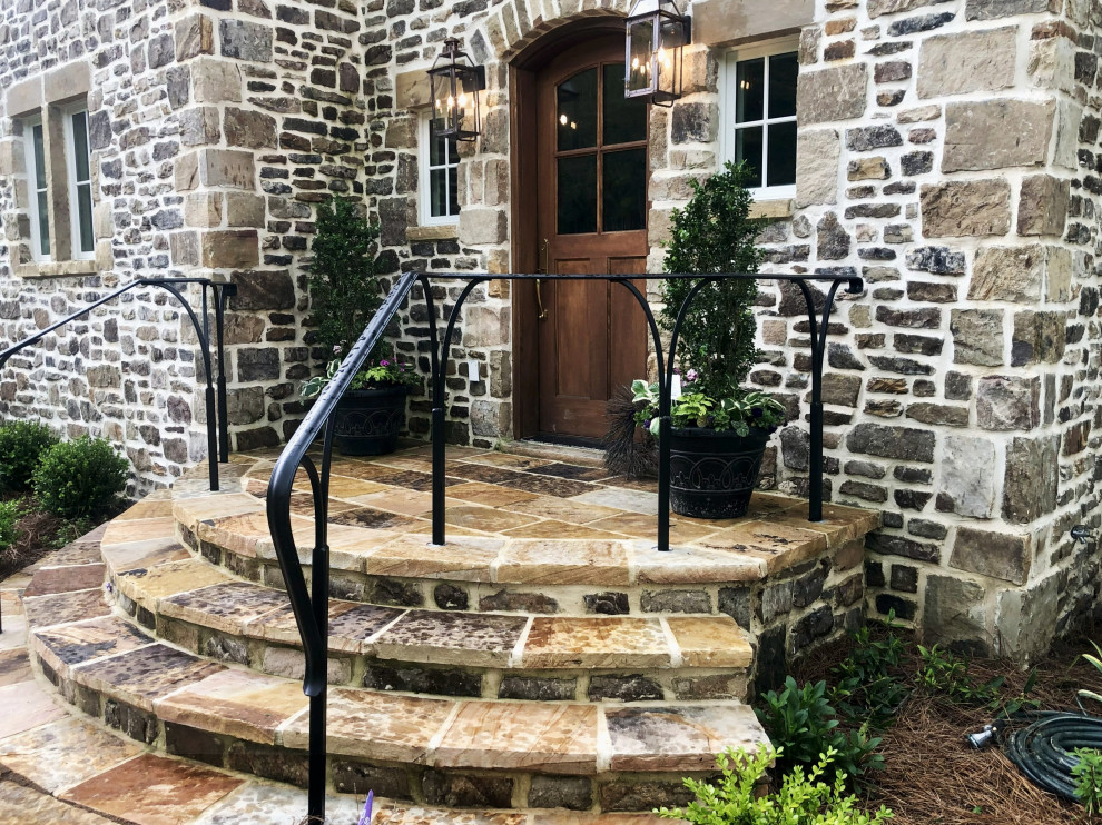 This is an example of a small traditional full sun front yard landscaping in Other.