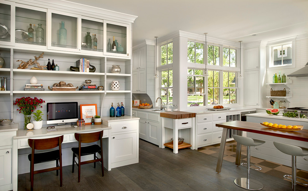 This is an example of a country eat-in kitchen in Chicago with open cabinets, white cabinets and white splashback.