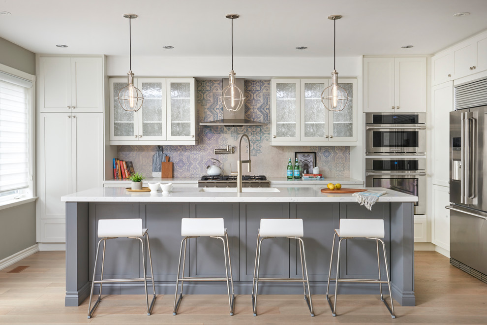 Example of a transitional kitchen design in Toronto