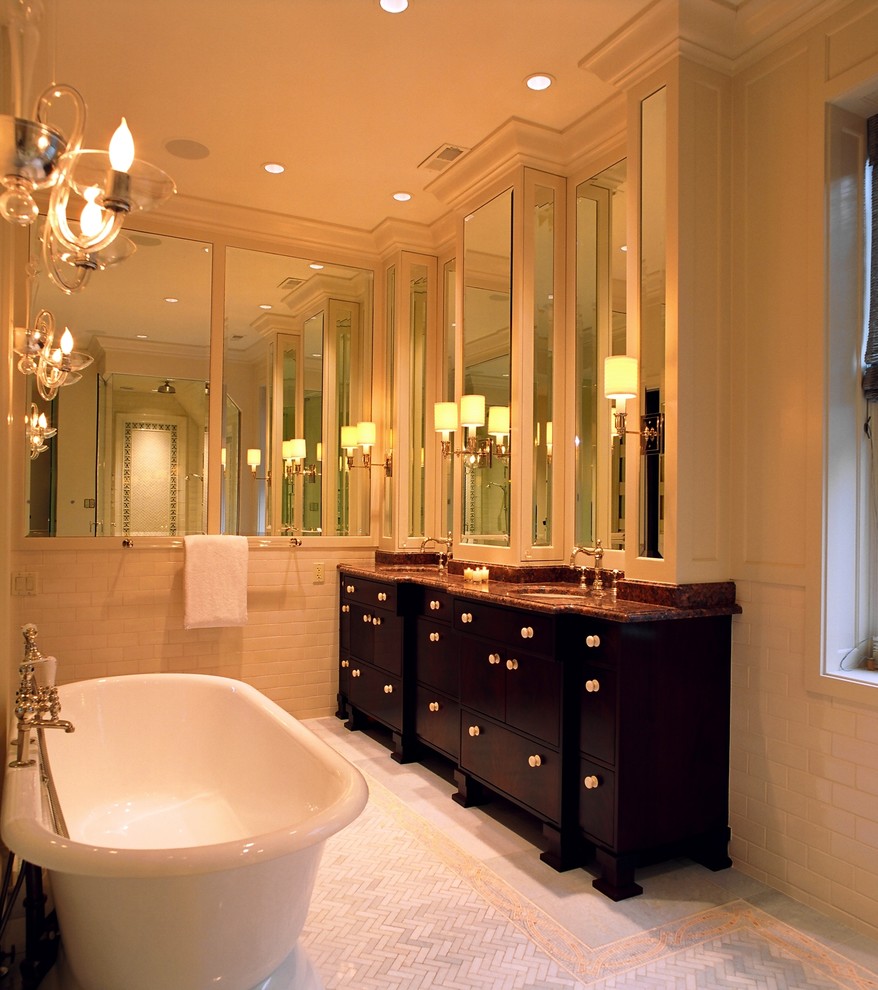 Inspiration for a mid-sized traditional master bathroom in Chicago with an integrated sink, furniture-like cabinets, dark wood cabinets, granite benchtops, a freestanding tub, an alcove shower, a two-piece toilet, beige tile, subway tile, beige walls and mosaic tile floors.