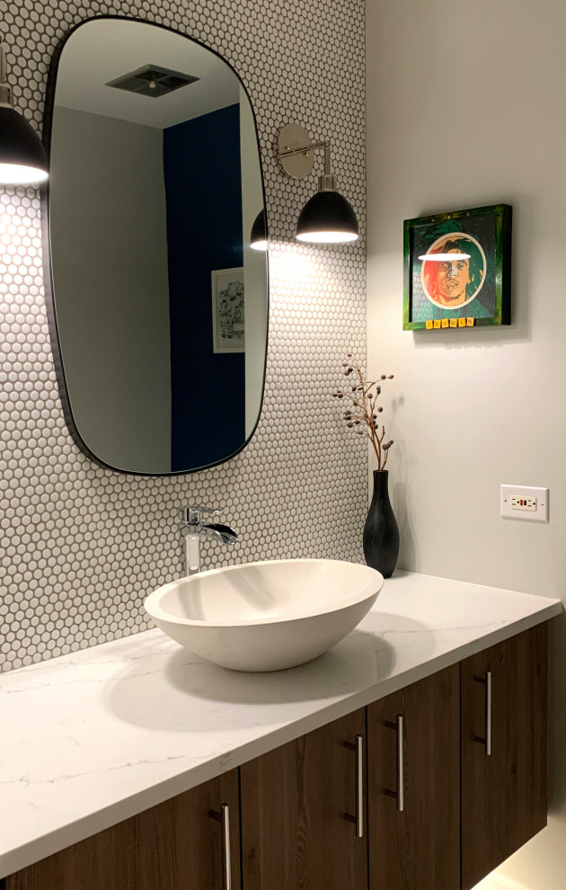 Photo of a medium sized modern shower room bathroom in Chicago with flat-panel cabinets, medium wood cabinets, white tiles, porcelain tiles, blue walls, porcelain flooring, a vessel sink, engineered stone worktops, black floors, white worktops, a single sink and a floating vanity unit.