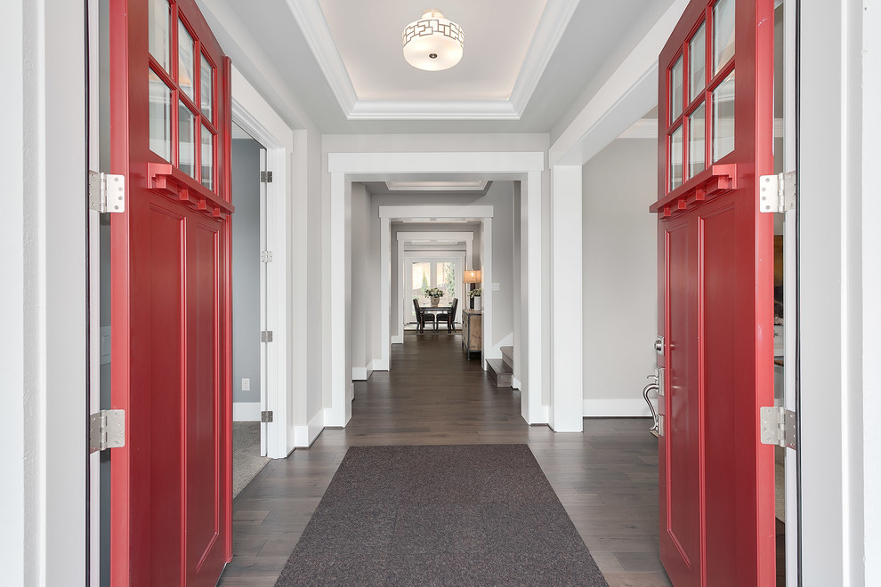 Large arts and crafts foyer in Seattle with grey walls, medium hardwood floors, a double front door, a red front door and grey floor.