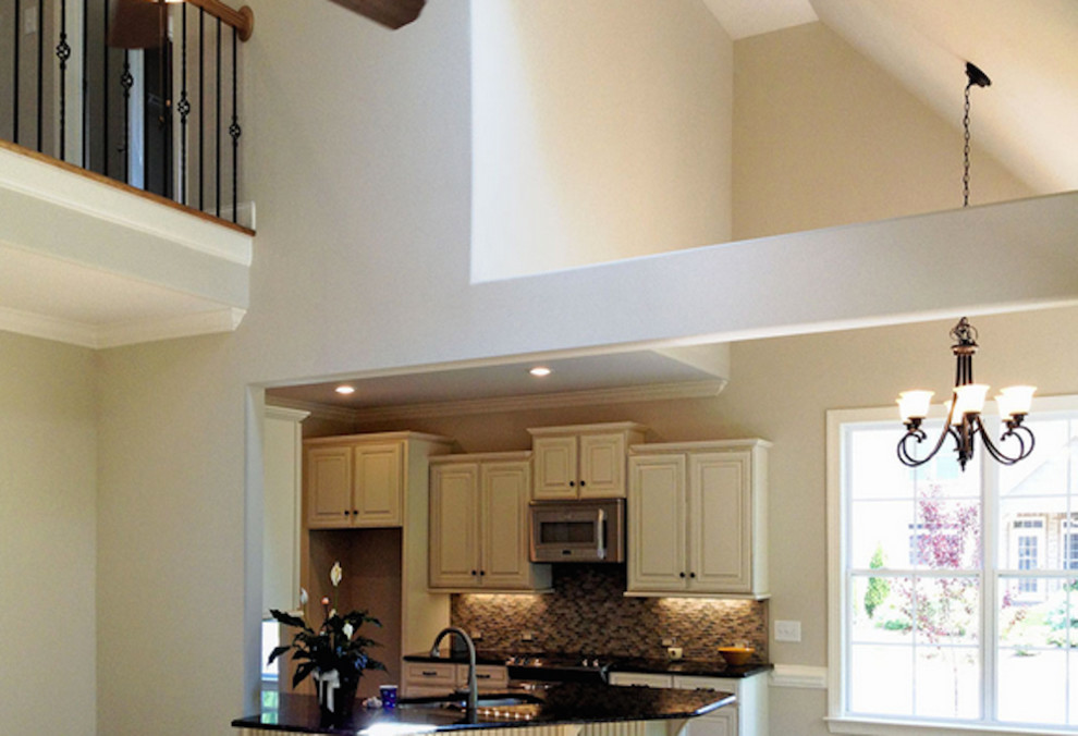Mid-sized transitional l-shaped open concept kitchen photo with a peninsula