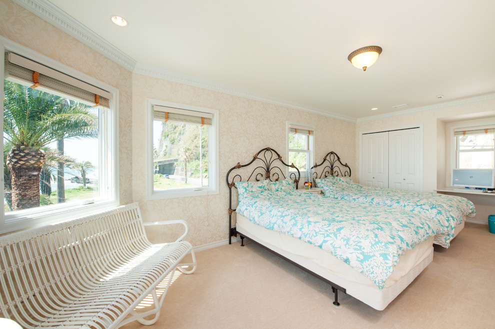 Tropical bedroom in Other with beige walls and beige floor.