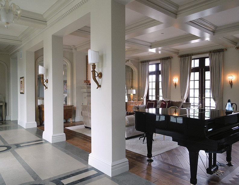 Large ornate formal medium tone wood floor, brown floor and coffered ceiling living room photo in Chicago with a standard fireplace and a stone fireplace