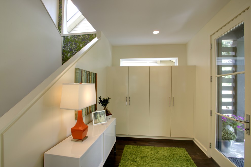 Contemporary entryway in Minneapolis with white walls.