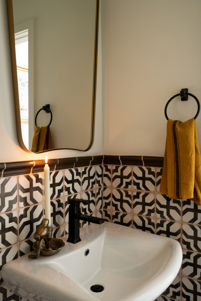 Inspiration for a small mediterranean powder room remodel in Los Angeles with multicolored walls and a freestanding vanity