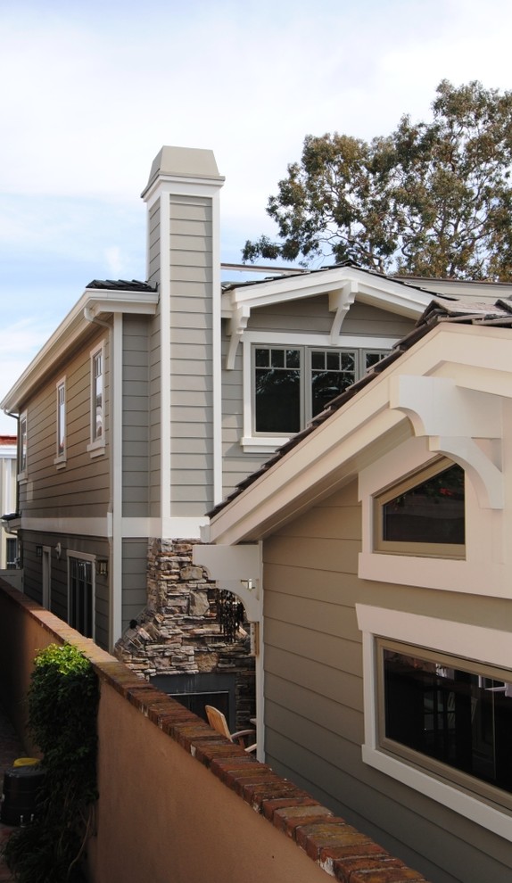 Large traditional two-storey grey exterior in Orange County with mixed siding.